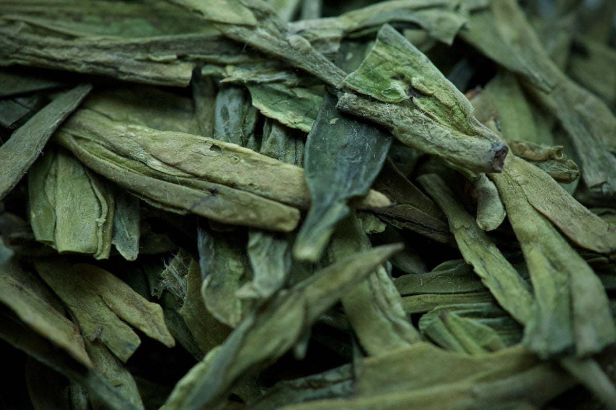 Dried green tea leaves in a pile