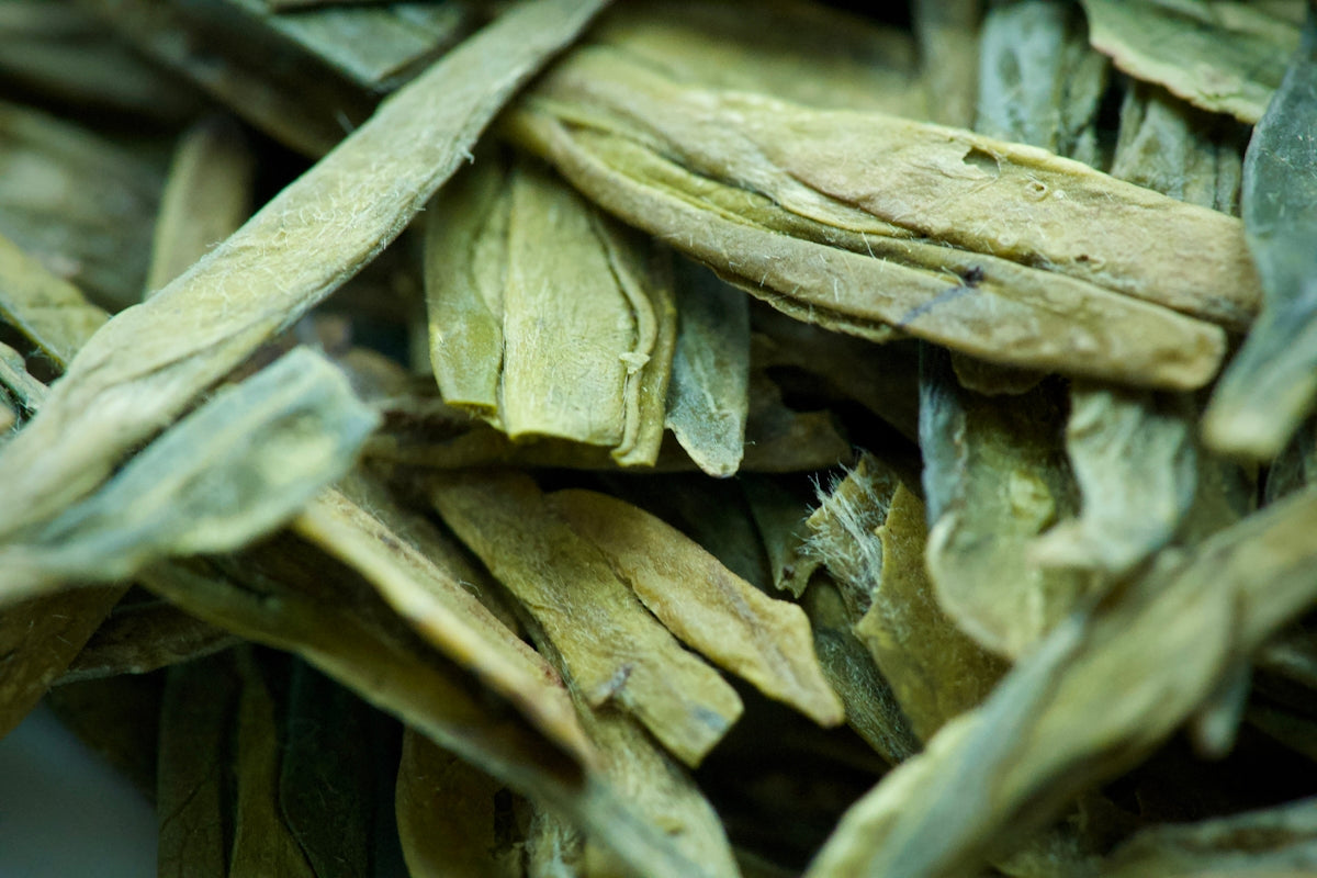 Dried green tea leaves in a pile